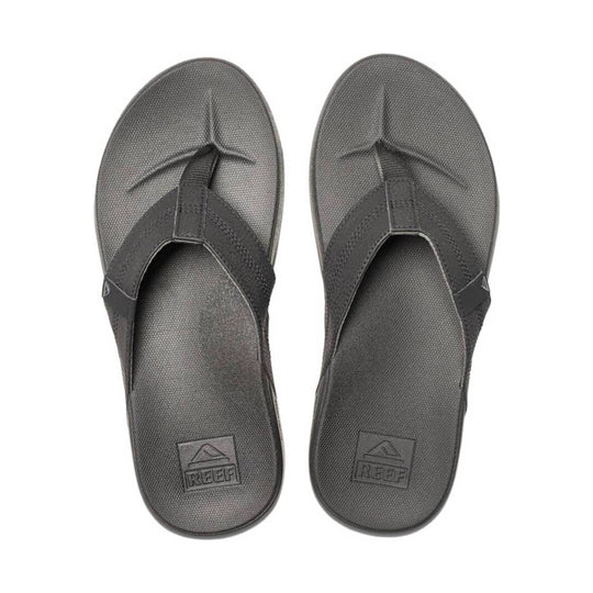 Dark gray thong sandals with textured footbeds and REEF logo on the heel