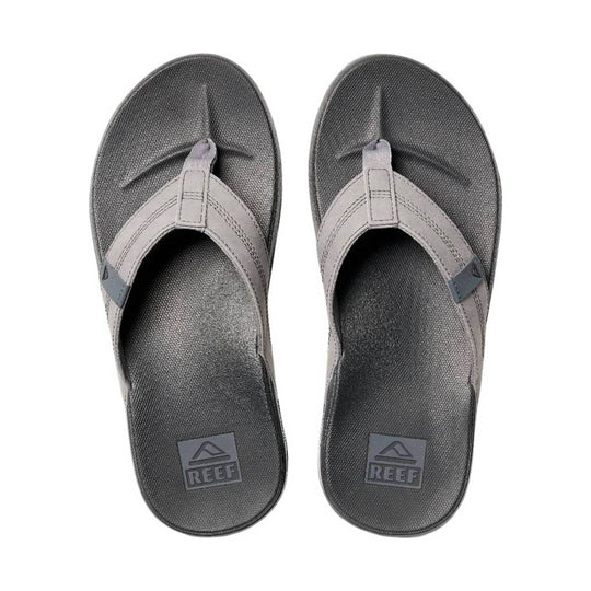 Grey thong sandals with textured footbeds and REEF logos