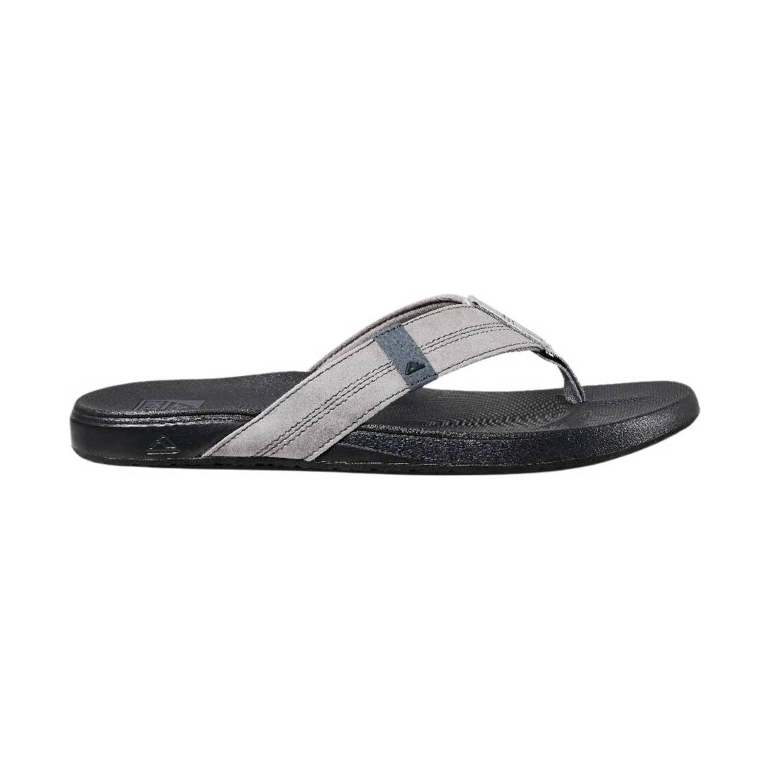 Grey thong flip-flop with a black cushioned sole and stitched strap