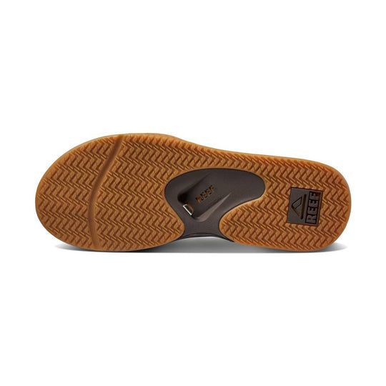 Brown textured sandal outsole with REEF logo