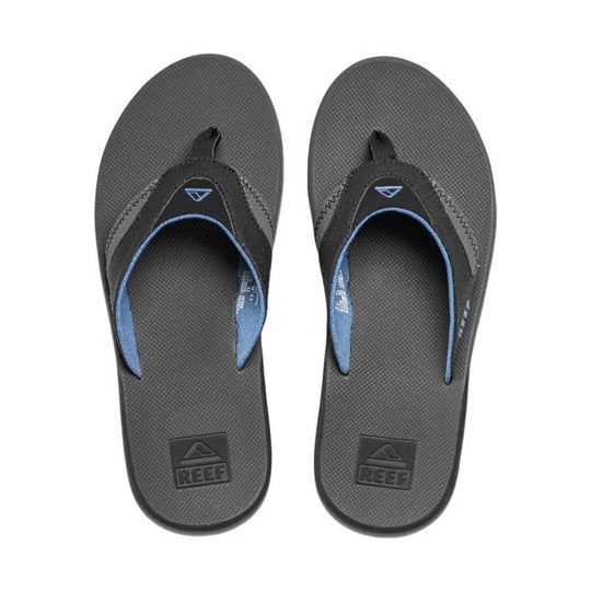 Pair of dark gray flip-flops with blue trim and Reef logo on the footbeds