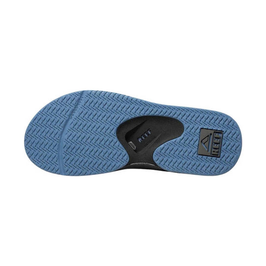 Blue rubber sandal sole with black arch cutout and REEF logo