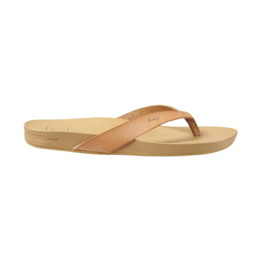Beige thong sandal with a metallic rose-gold strap and platform sole