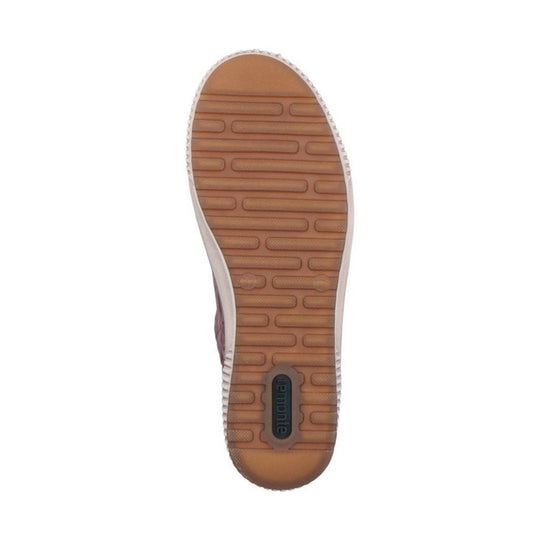 Brown shoe sole with tread pattern and visible remonte logo