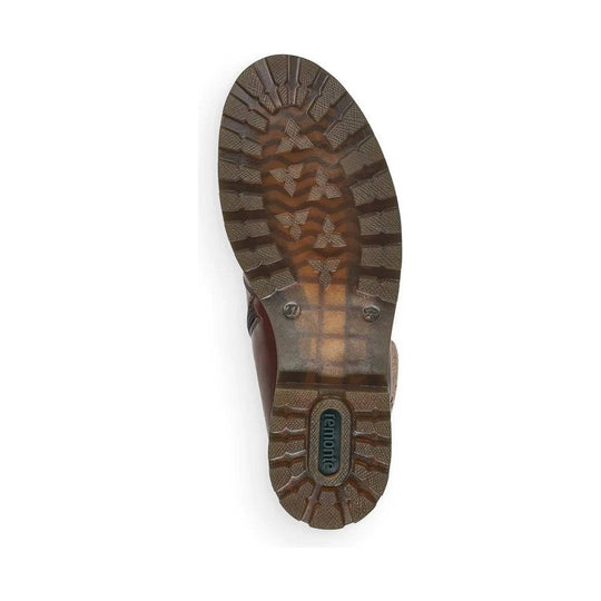Brown lugged shoe sole with a visible Remonte logo