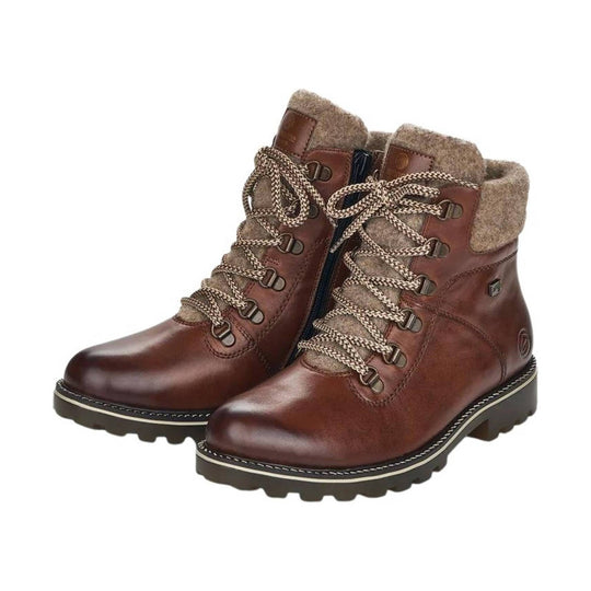 Brown leather ankle boots with fleece cuffs, braided laces, and lug soles