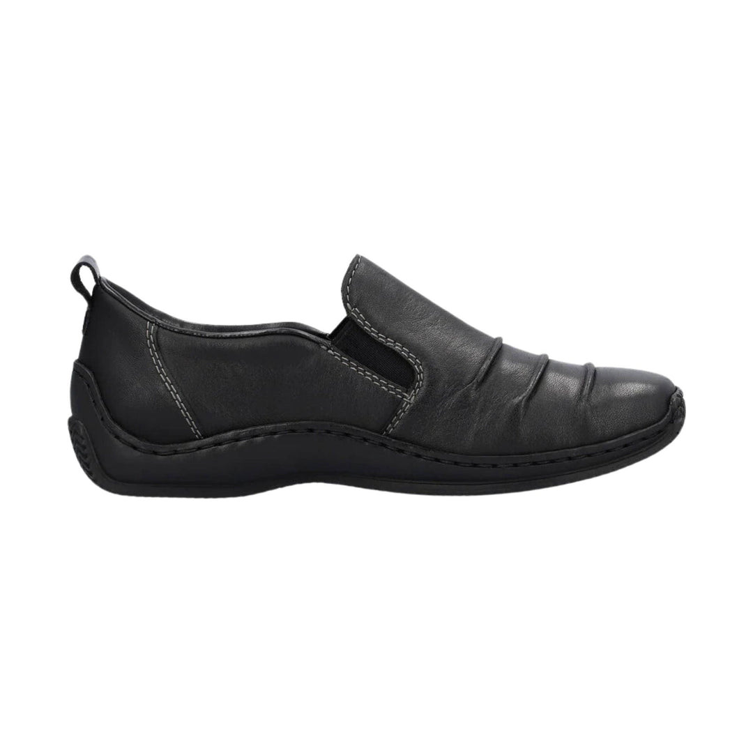 Black slip-on leather shoe with elastic side panels and a low wedge sole, side view