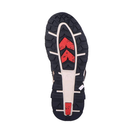 Black lugged boot sole with white traction lines and red chevron inserts