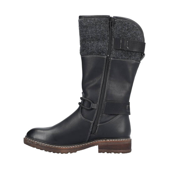 Black knee-high boot with side zipper, wool cuff, and brown lug sole
