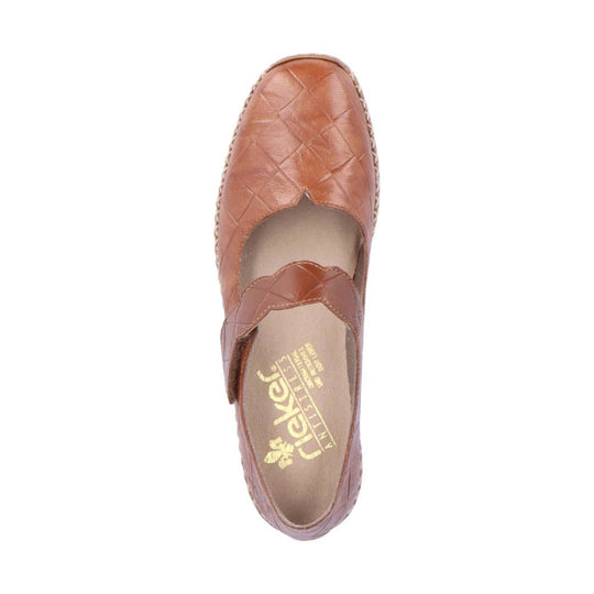 Brown quilted closed-toe slingback shoe with a cutout vamp and woven sole trim
