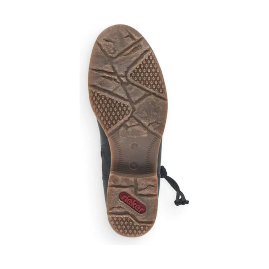 Boot sole with brown tread and a visible Rieker logo