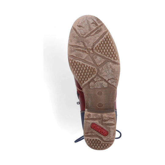 Boot outsole with tan tread and red Rieker logo near the heel
