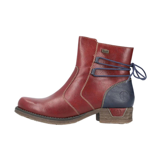 Wine-red ankle boot with blue side lacing, stitched panels, and a low wooden heel