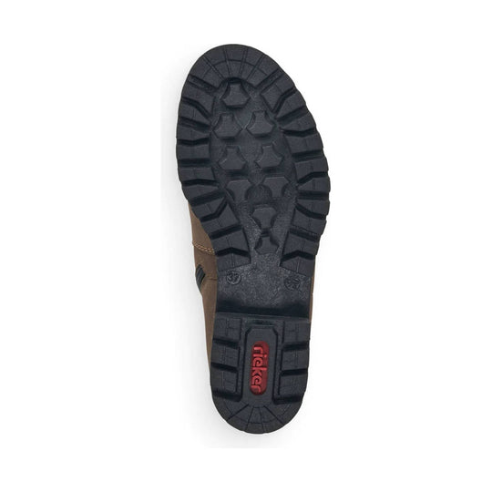 Boot sole with deep black tread and a red Rieker logo