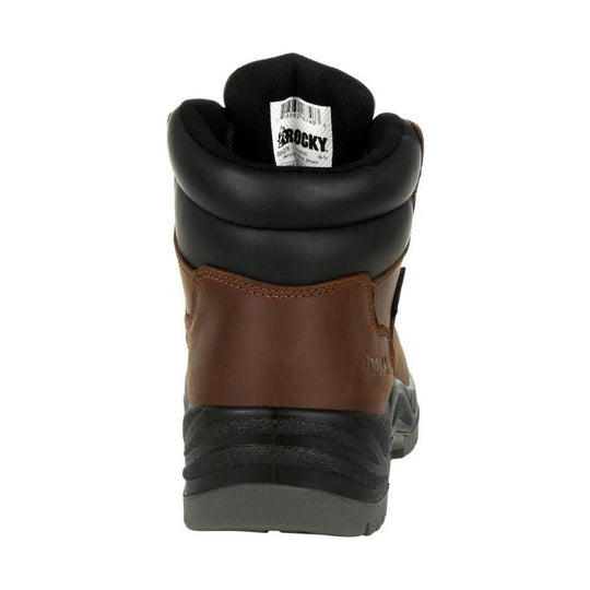 Rear view of a brown and black work boot with a padded collar, gray sole, and tongue label
