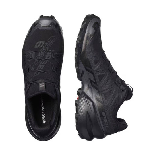 Black trail running shoe shown from top and side with a lugged outsole and speed lacing