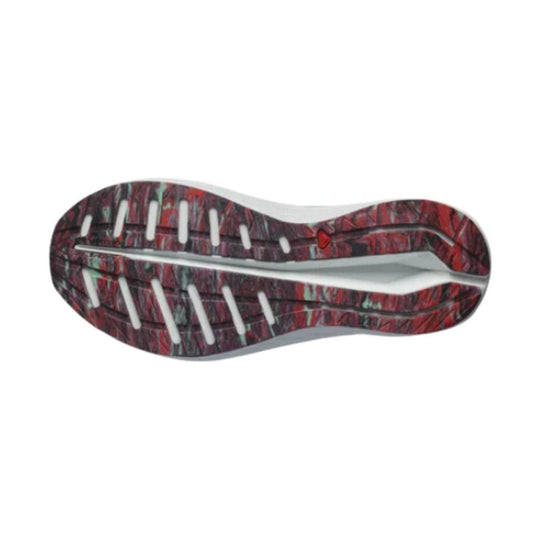 Shoe outsole with red and black tread pattern, white grooves, and a curved midfoot channel