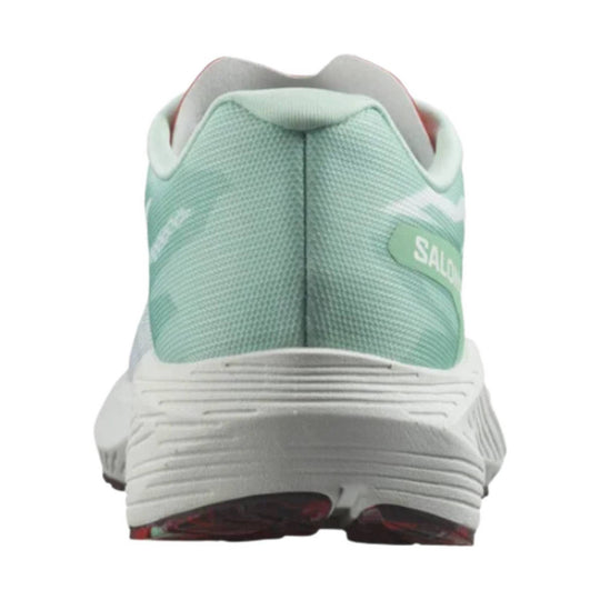 Mint green and white running shoe heel view with textured mesh upper and white sole