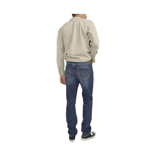 Back view of straight-leg blue jeans with five pockets and a beige button-up shirt