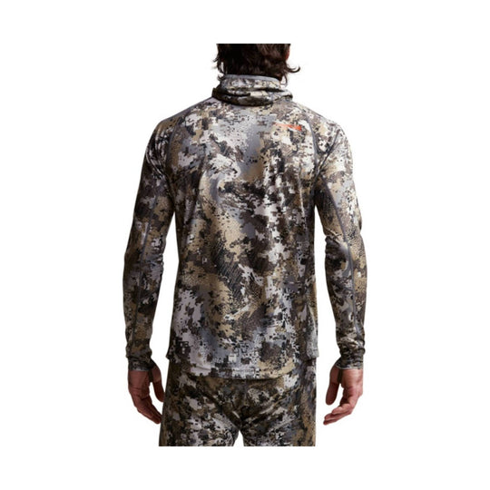 Long-sleeve camouflage hooded top shown from the back on a model