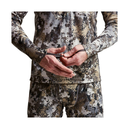 Long-sleeve camouflage performance hoody with a front zip and thumb holes