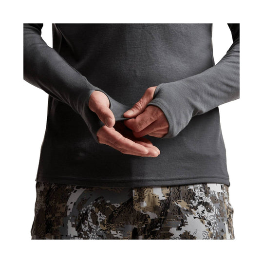 Long-sleeve dark gray performance top with thumbholes