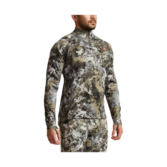 Camouflage long-sleeve quarter-zip top with a mock neck, shown on a male model