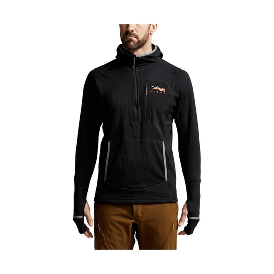 Black hooded pullover with quarter zip, chest logo, front pocket, and thumbhole cuffs