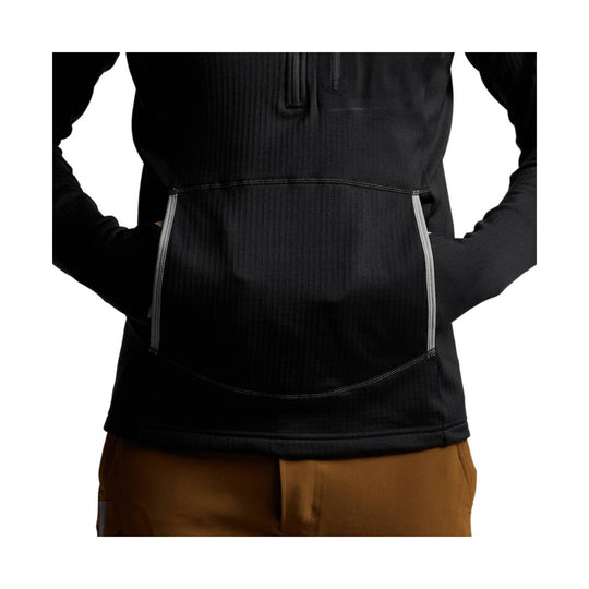 Black hooded pullover with front quarter-zip and chest pocket, shown on a model