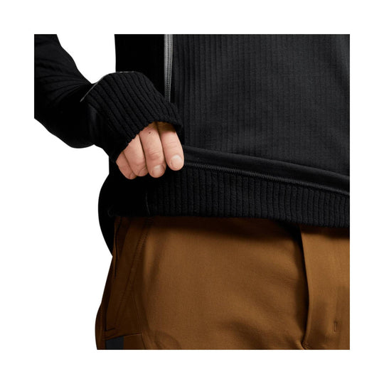 Black hooded fleece pullover with ribbed cuffs and hem, shown with tan pants
