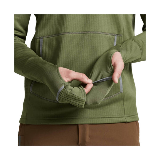 Olive green long-sleeve hooded top with thumbholes and zippered chest pocket