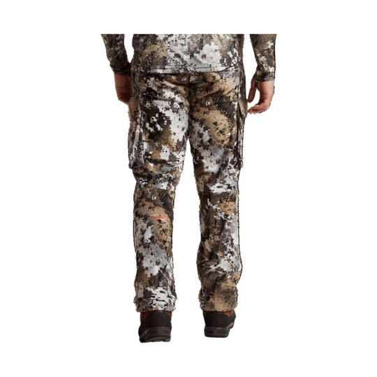Camouflage cargo pants shown from the back with side pockets and ankle cuffs