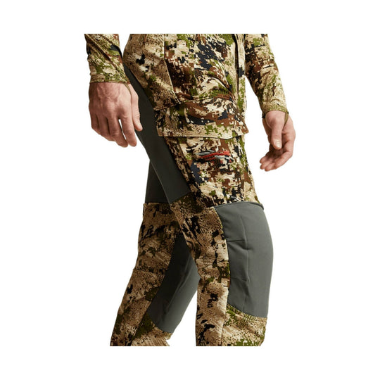 Camouflage hunting pants with black stretch panels and reinforced knees