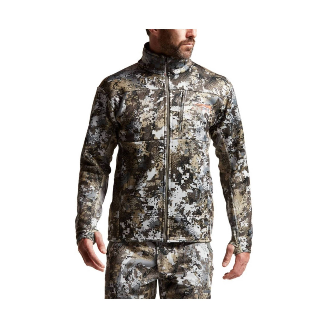 Camouflage zip-up jacket with a high collar and chest pocket, shown with matching camouflage pants.