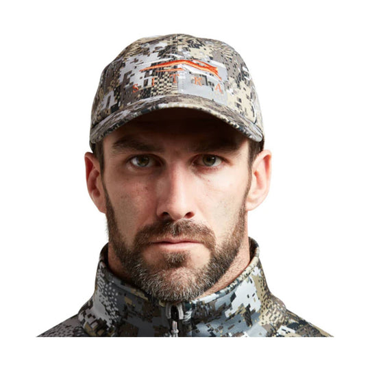 Camouflage baseball cap and matching zip-up neck gaiter on a man facing forward