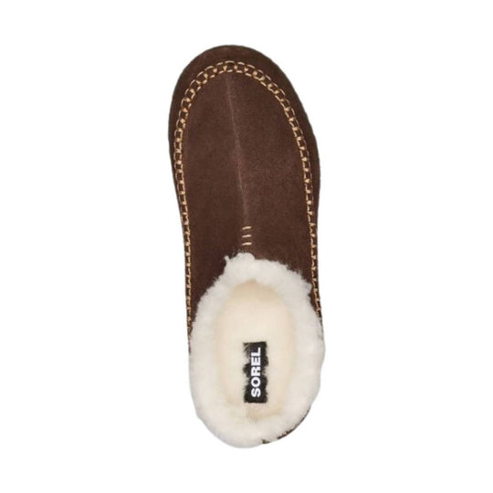 Brown suede slipper with cream shearling lining, moc-toe stitching, and SOREL logo on the insole.