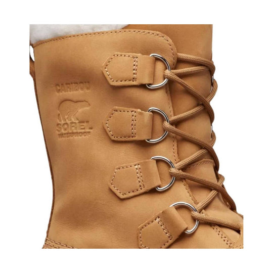 Tan leather winter boot with bungee laces, metal D-rings, and embossed branding