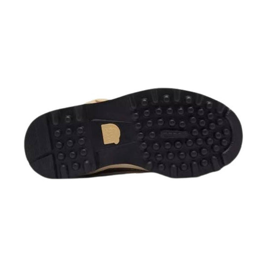 Black lugged boot sole with round traction lugs and a beige logo insert