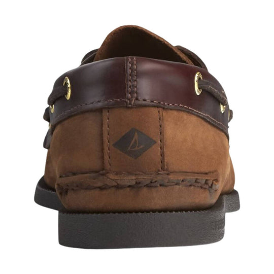 Brown leather boat shoe shown from the heel with dark laces, brass eyelets, and a rubber sole