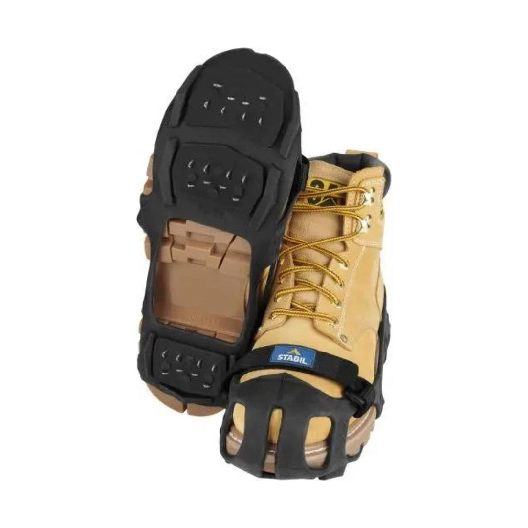 Tan lace-up boot traction cleats with black rubber grips on the sole and toe