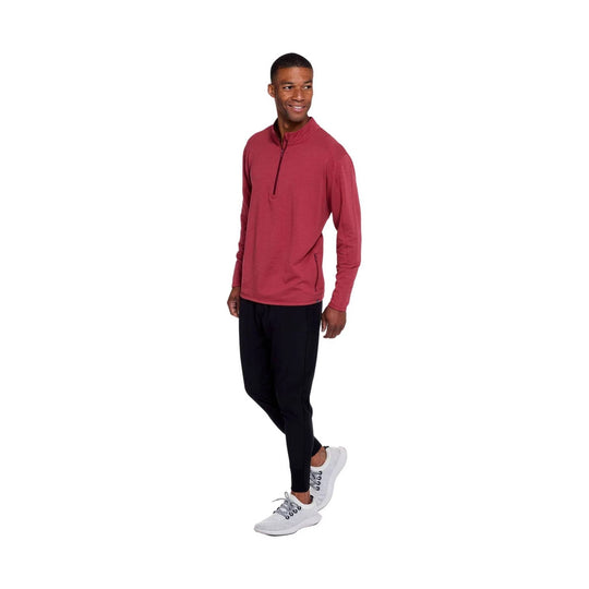 Red long-sleeve quarter-zip pullover with zip chest pocket and tapered black pants