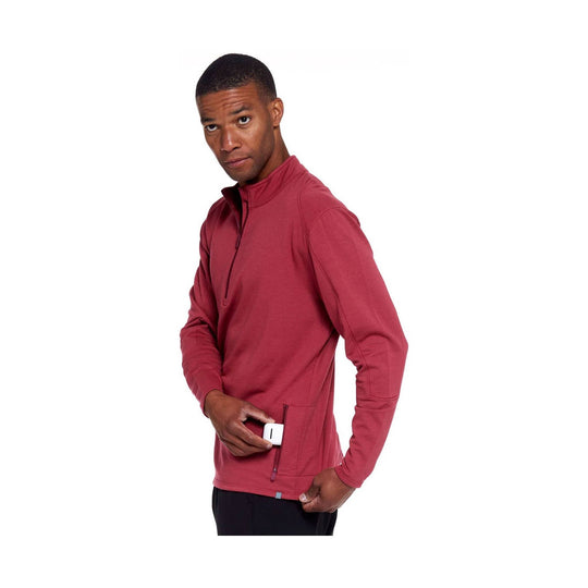Man wearing a red quarter-zip pullover with a chest pocket and long sleeves