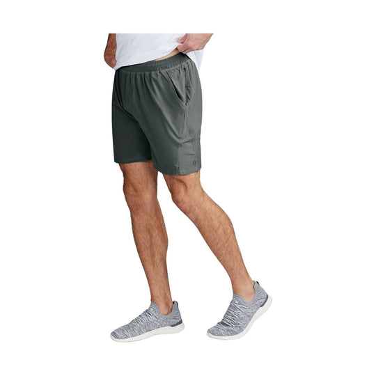 Dark gray athletic shorts with elastic waistband, side zip pocket, and perforated side panel on a model