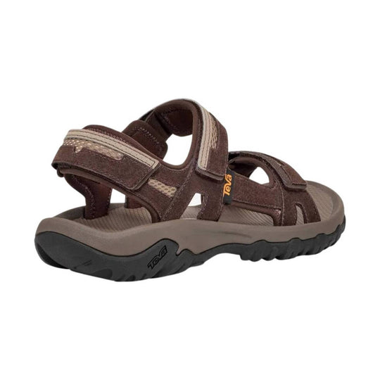 Brown outdoor sandal with closed toe, adjustable straps, and thick black treaded sole