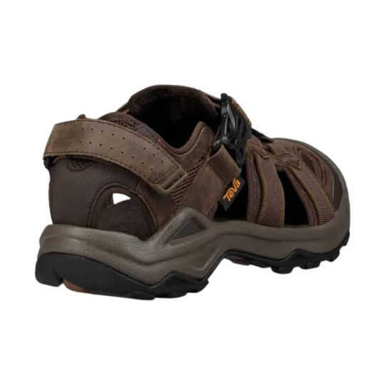 Brown closed-toe hiking sandal with hook-and-loop heel strap and thick treaded sole