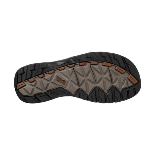 Rugged rubber shoe outsole with black tread and brown and gray midfoot sections