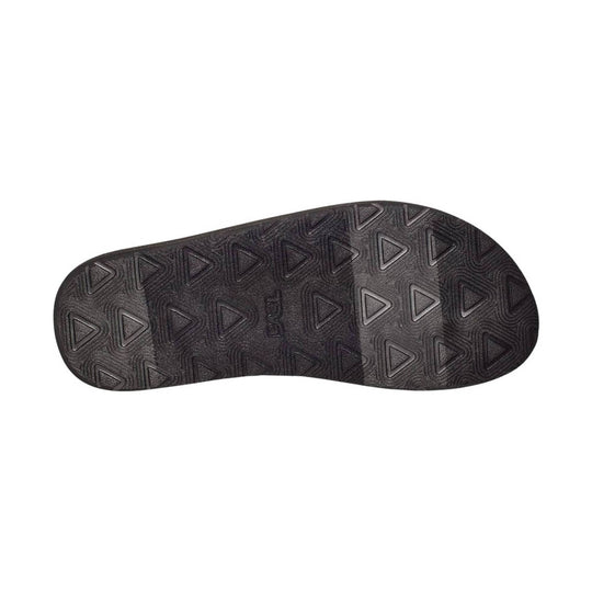 Black sandal outsole with triangular tread pattern and embossed Teva logo
