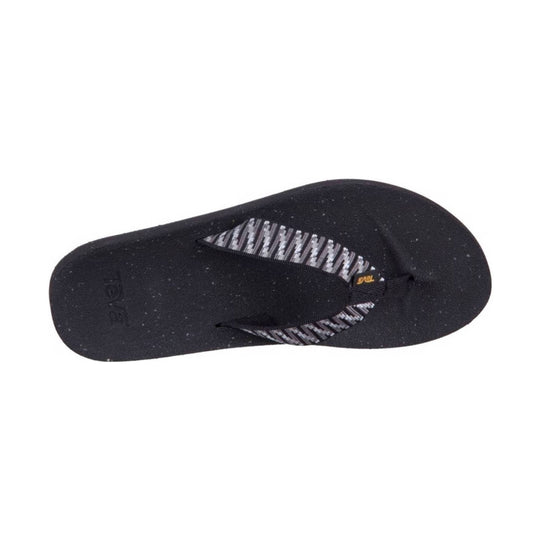 Black thong sandal with patterned gray straps and Teva logo on the footbed