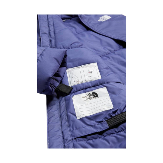 Blue insulated jacket lining with care and glove-keeper labels