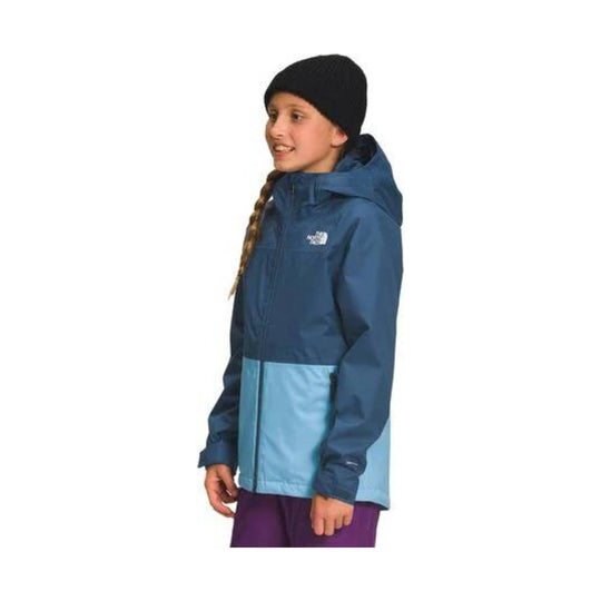 Girl wearing a two-tone blue hooded jacket with a black beanie, shown in side profile.